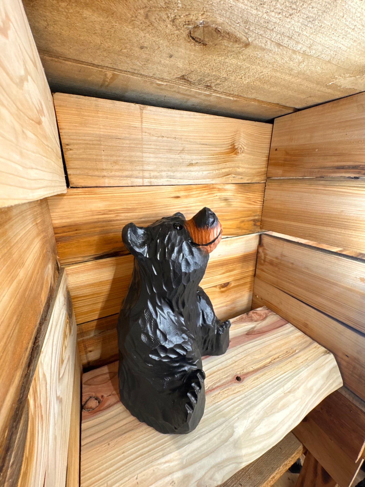 Sitting Black Bear Looking Up – 15” Chainsaw Carving