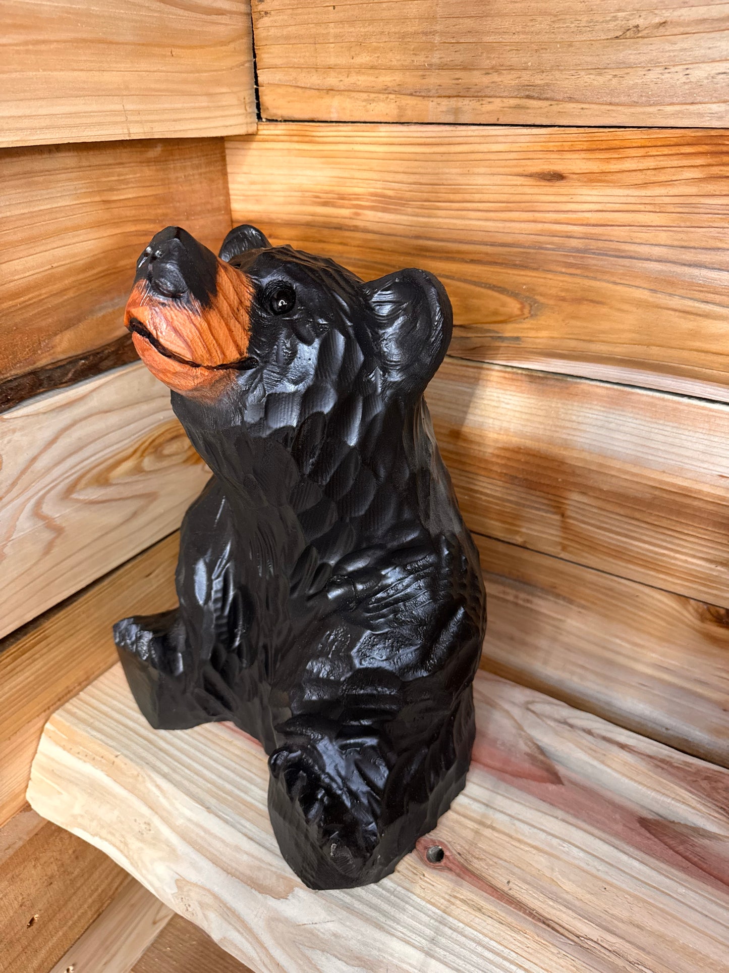 Sitting Black Bear Looking Up – 15” Chainsaw Carving