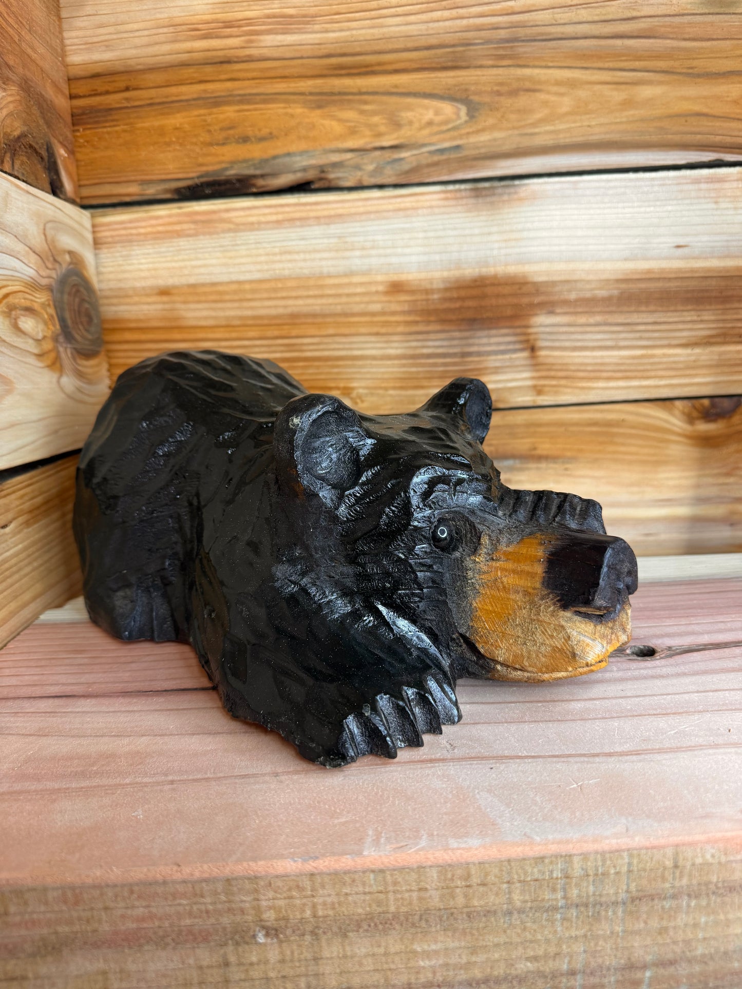 Chainsaw Carved Black Bear Peeking with Paw Over Eye – 10”