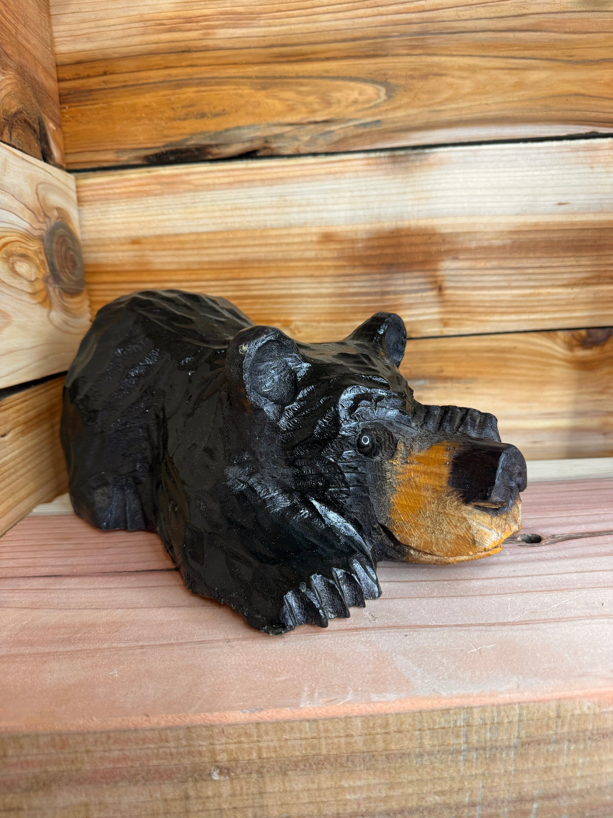 Chainsaw Carved Black Bear Peeking with Paw Over Eye – 10”