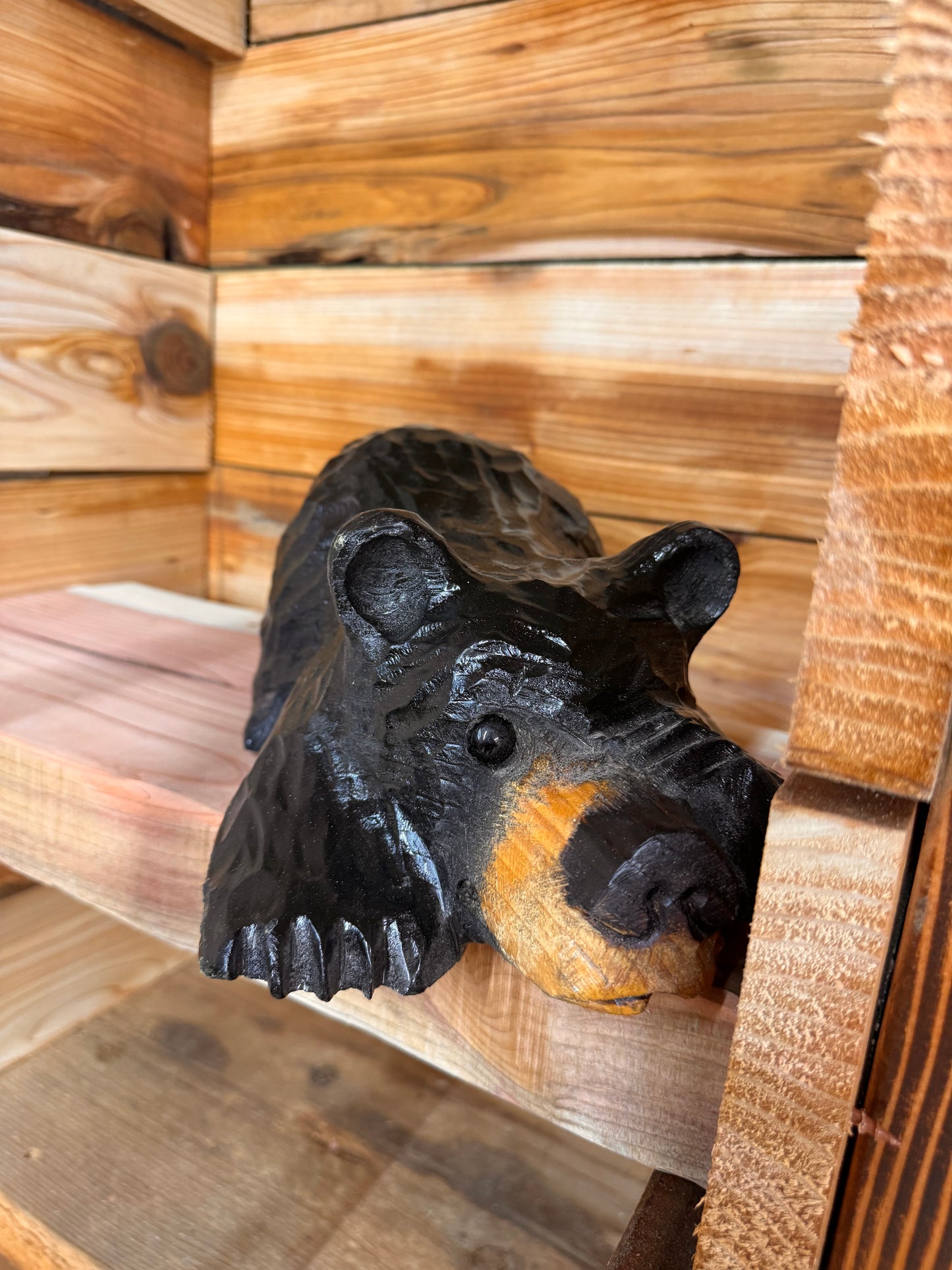 Chainsaw Carved Black Bear Peeking with Paw Over Eye – 10”