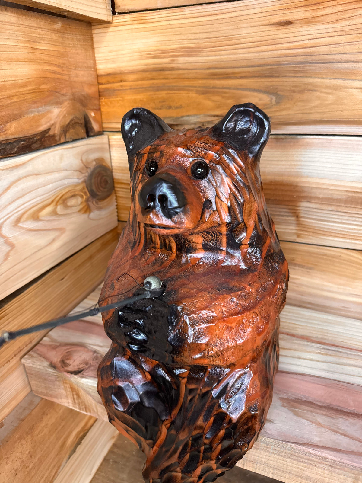 Chainsaw Carved Brown Bear Sitting on Ledge with Fishing Pole – 15”
