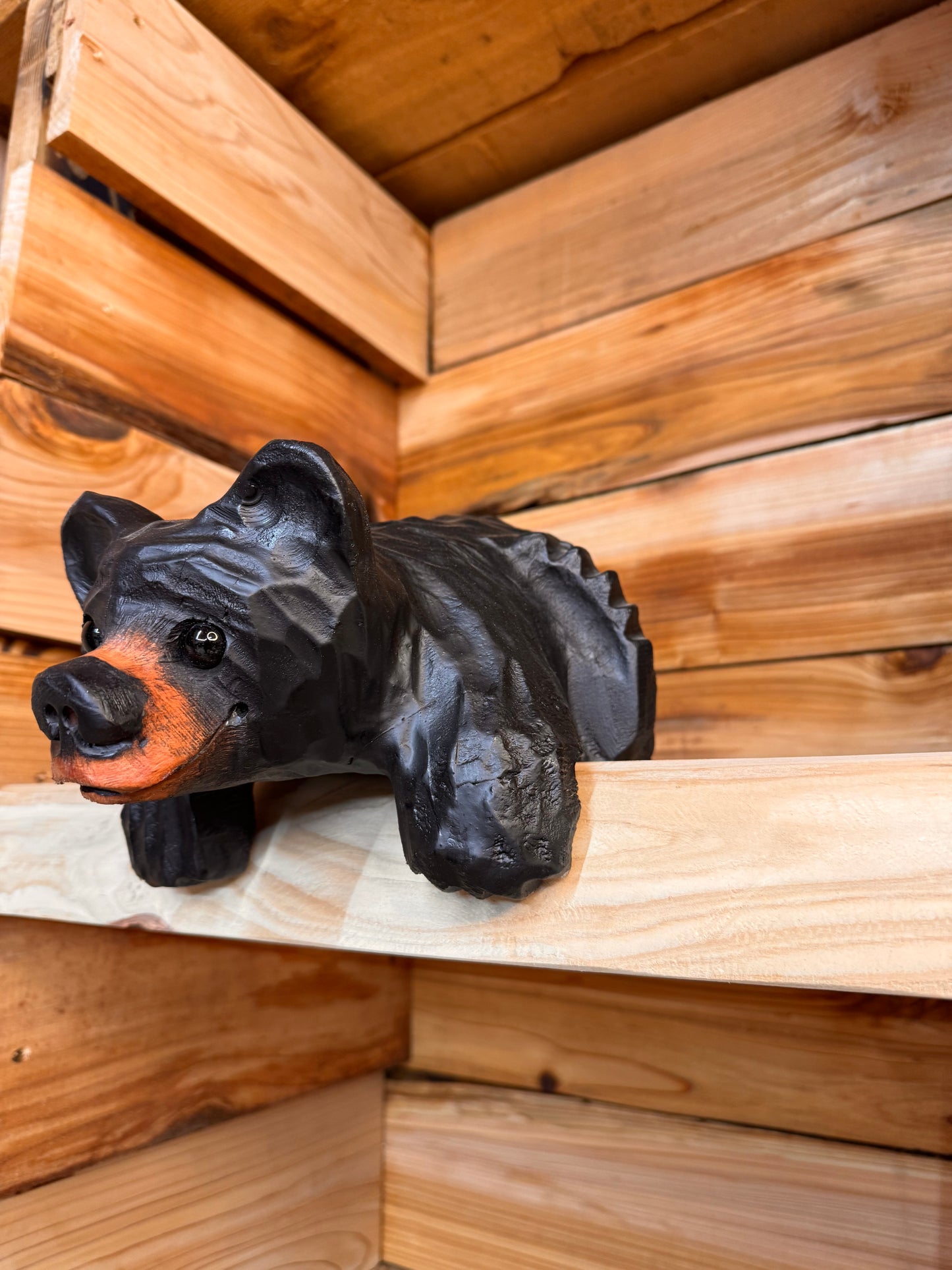 Chainsaw Carved Black Shelf Bear with Hanging Paws – 10”