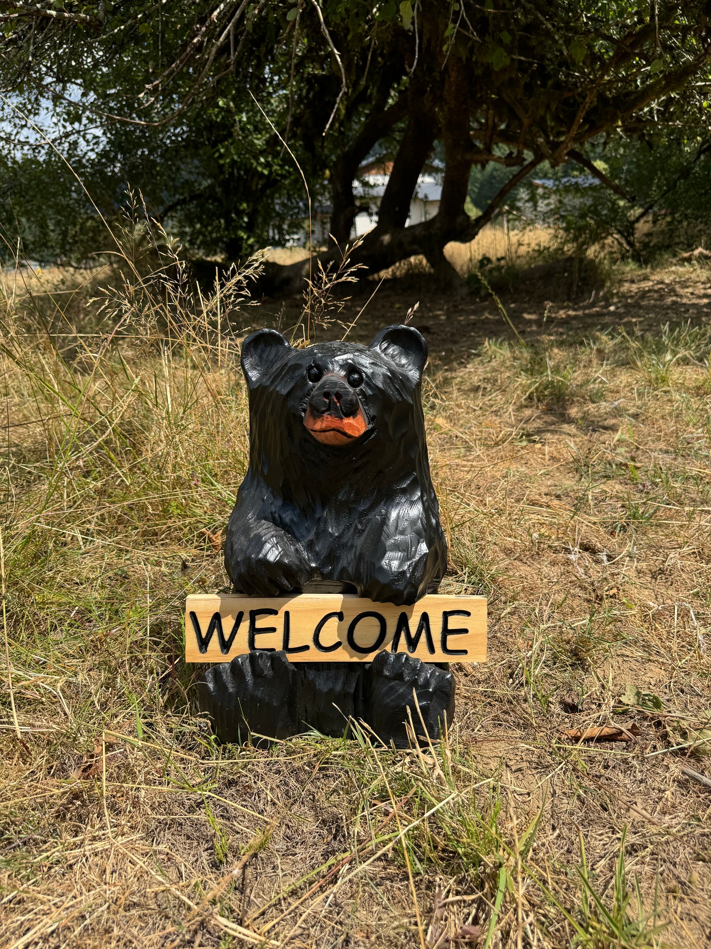 Wood Carved Bear Holding Reversible Welcome Sign - Customizable, 15 Inches Tall - Black