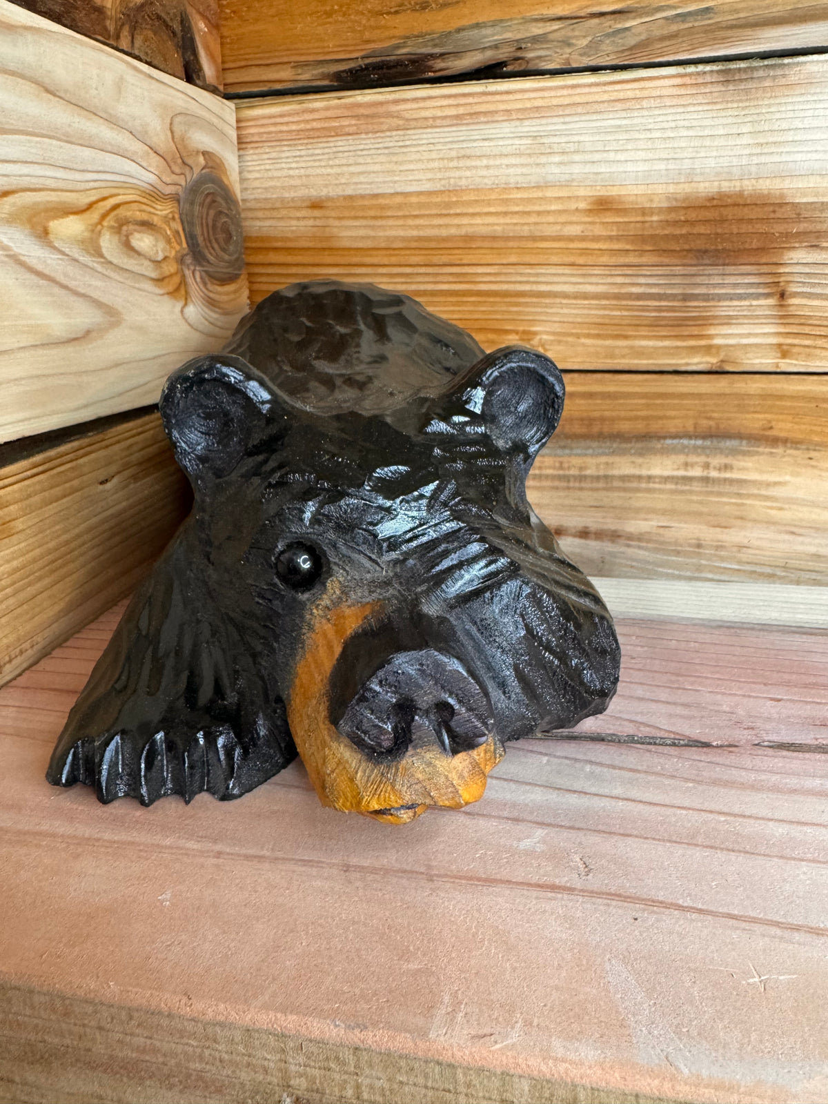 Chainsaw Carved Black Bear Peeking with Paw Over Eye – 10”