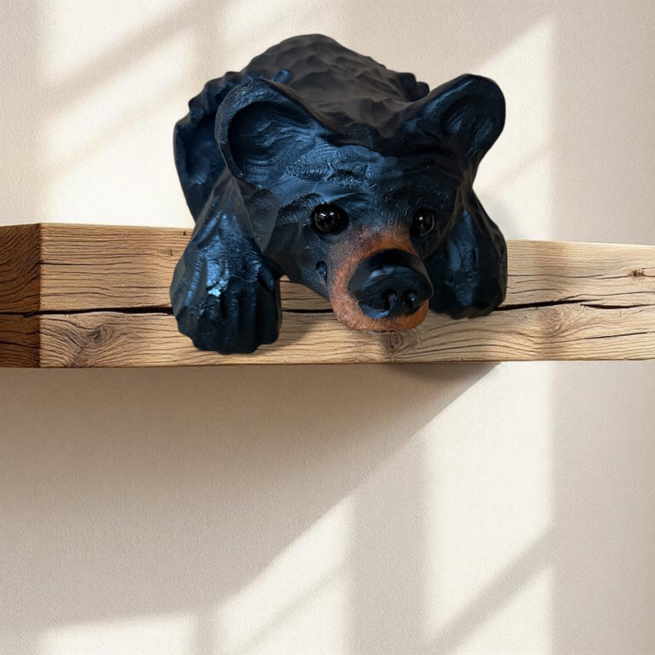 Chainsaw Carved Black Shelf Bear with Hanging Paws – 10”