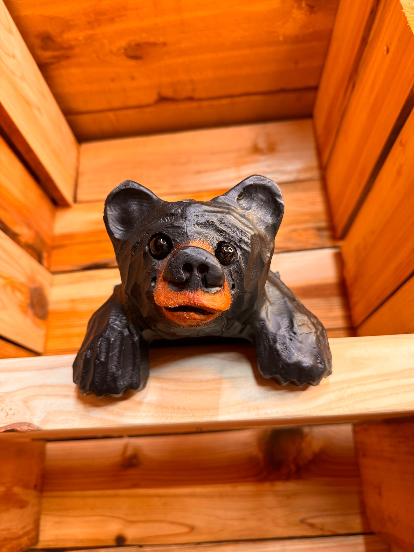 Chainsaw Carved Black Shelf Bear with Hanging Paws – 10”