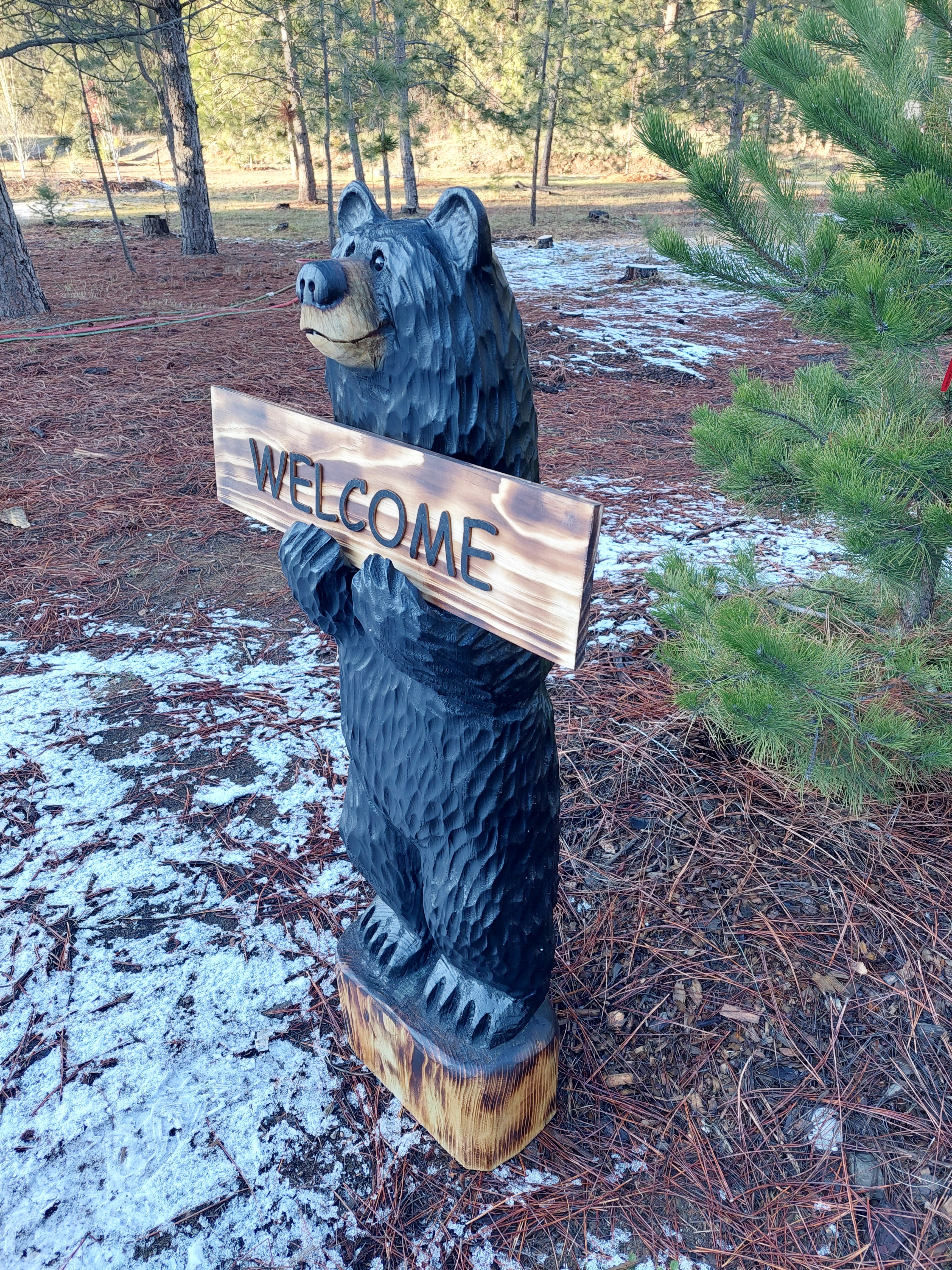 Black Bear Carving with Reversible Welcome Sign